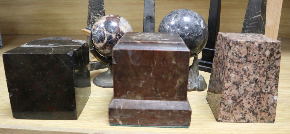 A group of marble obelisks and balls